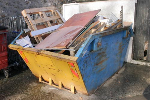 Professionals clearing furniture in a Pinner home